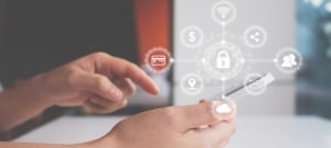 Data protection and security important information in your mobile phone, Woman hand using smartphone and icon key on shield