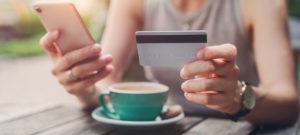 Woman shopping online with credit card