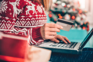 Women using credit card at home