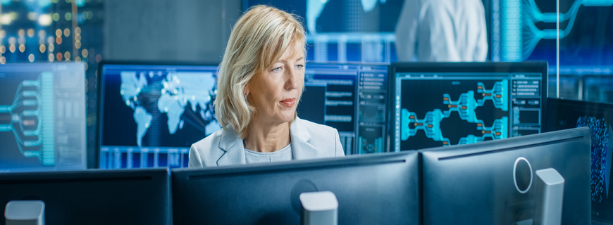 System Monitoring Room Professional Female Operator Observes Correct Functioning of the Facility. In the Background People Working with Interactive Map.