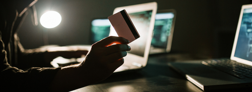 Hacker stealing information from a credit card